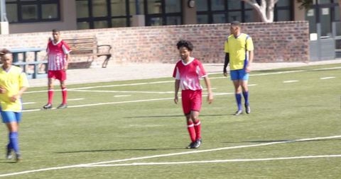 Youth Soccer Match Action on Sunny Field
