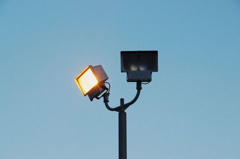 Modern Street Lights Against Clear Blue Sky