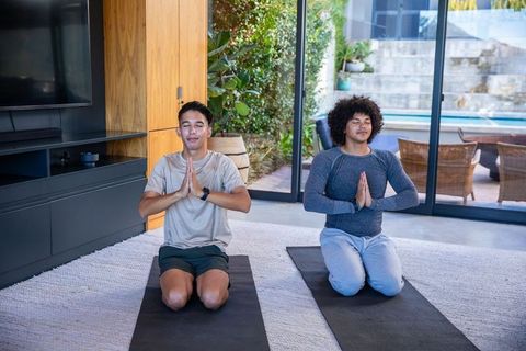 Diverse Male Friends Meditating at Home in Serene Modern Space