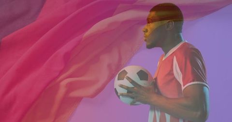 Vibrant Soccer Athlete with Dynamic Fabric and Gradient Background