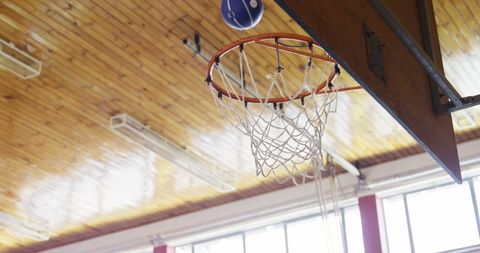 Indoor Gymnasium Basketball Hoop with Wooden Ceiling