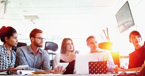 Team of Professionals Engaged in Strategic Office Meeting