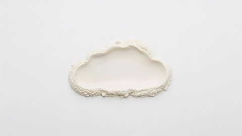 Creative cloud shaped milk powder on white backdrop