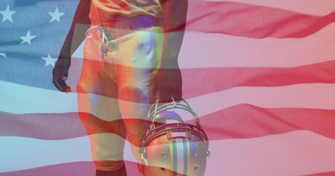 American football player proudly holding helmet with usa flag overlay