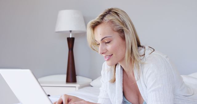 Smiling Woman Working on Laptop in Bedroom - Download Free Stock Images Pikwizard.com