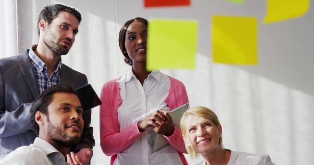 Diverse business team brainstorming with sticky notes - Download Free Stock Images Pikwizard.com