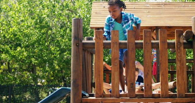 Child Enjoying Safe Play on Wood Playground Climber - Download Free Stock Images Pikwizard.com