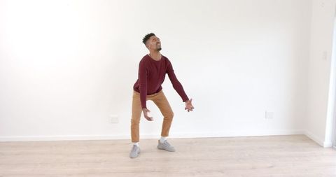 Energetic Dance Expression in Minimalistic Room - Download Free Stock Images Pikwizard.com