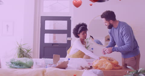 Diverse Couple Enjoys Recycling Time Together at Home