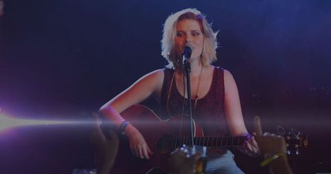 Young Musician Performing Live Acoustic Guitar Concert