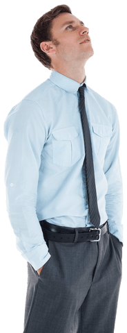 Confident Businessman Standing in Light Blue Shirt with Tie