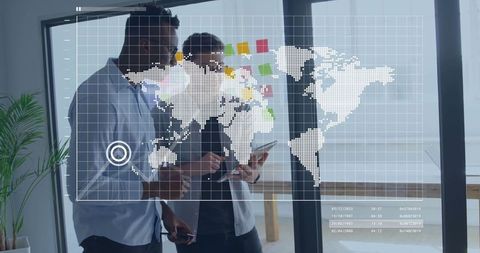 Business analysts collaborating on digital world map strategy