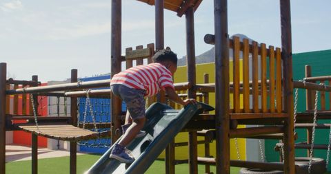 Young Boy Climbing Slide at School Playground on Sunny Day - Download Free Stock Images Pikwizard.com