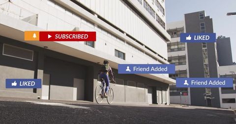 Cyclist on city street surrounded by digital social media icons
