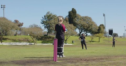 Female Cricketer Celebrating Victory on Field