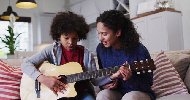 Mother Teaching Son to Play Acoustic Guitar at Home - Download Free Stock Images Pikwizard.com