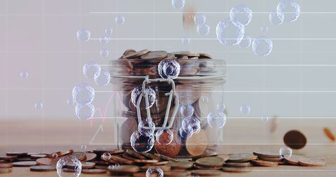 Coins in glass jar with floating bubbles on financial data background