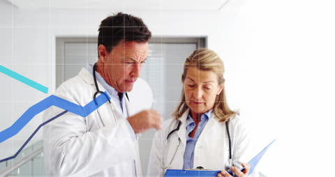 Senior Doctors Analyzing Financial Data in Healthcare Setting