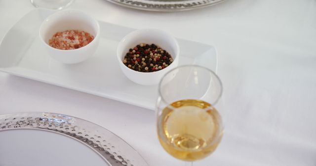 Elegant Table Setting with Salt, Pepper, and Wine Glass - Download Free Stock Images Pikwizard.com