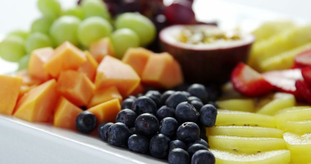 Close-Up of Fresh Mixed Fruits on White Plate - Download Free Stock Images Pikwizard.com