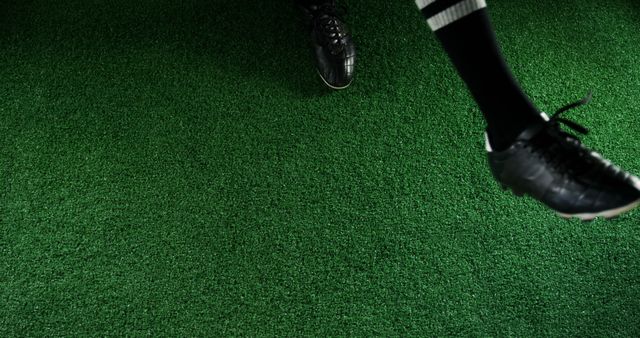 Soccer Player's Feet in Black Cleats Kicking Grass - Download Free Stock Images Pikwizard.com