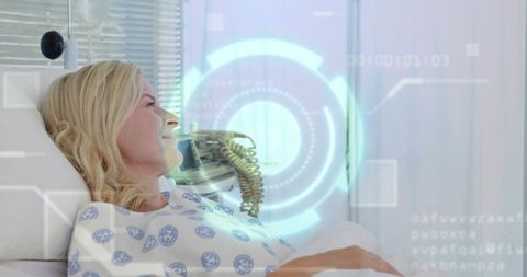 Mid adult woman resting in hospital bed with futuristic hud medical interface overlay