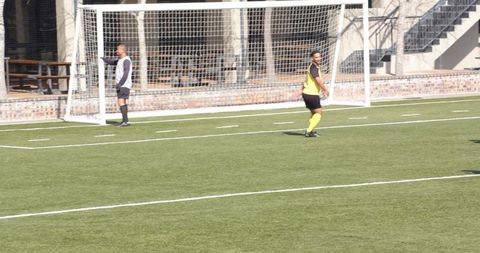 Young Soccer Player Sprinting on Field During Practice