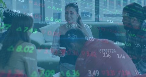 Diverse Colleagues Discussing Work with Financial Data Overlay