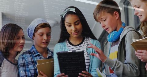 Students Collaborating on Tablet in School Hallway for Team Learning