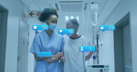 Nurse walking with senior patient in hospital corridor holding iv pole with social icons