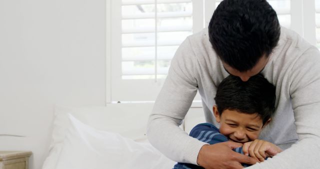 Father Hugging Son in Warm Family Moment - Download Free Stock Images Pikwizard.com