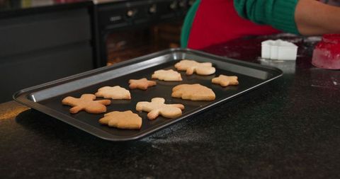 Homemade Christmas Cookies on Baking Tray in Cozy Kitchen