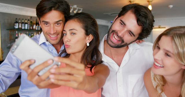 A group of young adults is taking a selfie together, with copy space - Download Free Stock Photos Pikwizard.com