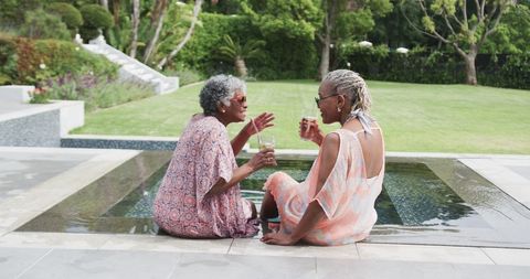 Senior Female Friends Enjoying Summer by Poolside - Download Free Stock Images Pikwizard.com