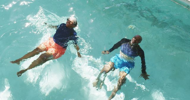 Image of happy senior american african couple exercising in the pool - Download Free Stock Photos Pikwizard.com