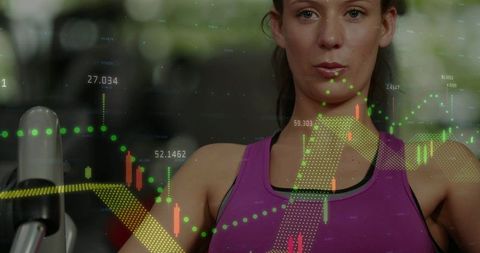Woman pressing gym machine handles with stock overlay representing performance metrics