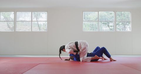 Female Judo Fighters Engaged in Intense Martial Arts Training