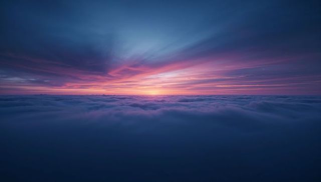 Vibrant Sunrise Over Layer of Clouds with Pink and Orange Sky