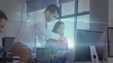 Coworkers Collaborating Over Digital Tablet in Modern Office