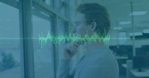 Man Analyzing Financial Data Overlayer in Modern Office Environment - Download Free Stock Images Pikwizard.com