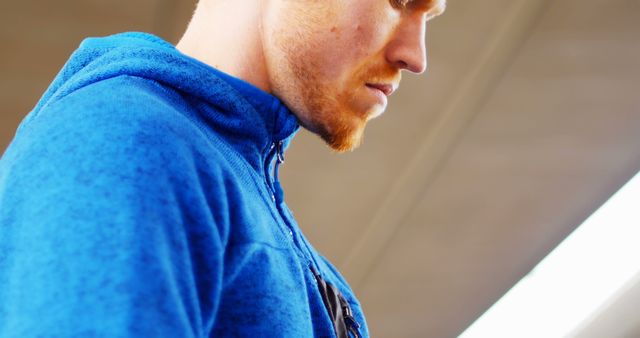 Red-haired Man in Blue Hoodie Looking Down - Download Free Stock Images Pikwizard.com