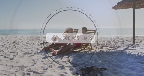 Couple experiencing virtual likes on beach getaway
