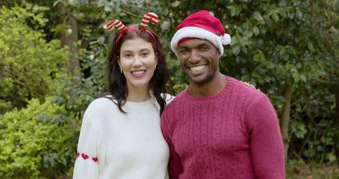 Joyful Couple Embracing Christmas Spirit Outdoors