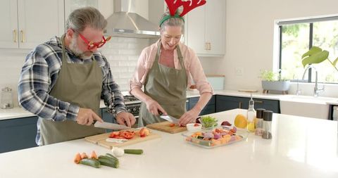 Festive Couple Preparing Vegetables in Modern Kitchen