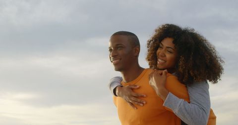 Romantic Couple Posing on Beach at Sunset