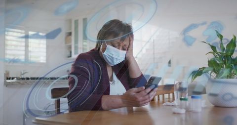 senior woman with face mask using smartphone at home - Download Free Stock Images Pikwizard.com