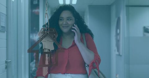 Businesswoman Discussing real estate Success on Mobile Phone in Modern Office