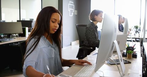 Focused Business Professionals Working at Office Desks - Download Free Stock Images Pikwizard.com
