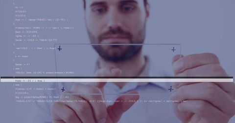 Developer manipulating holographic UI with floating code on transparent glass panel
