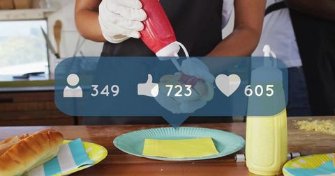 Person Preparing Food with Ketchup alongside Social Media Interaction Icons - Download Free Stock Images Pikwizard.com
